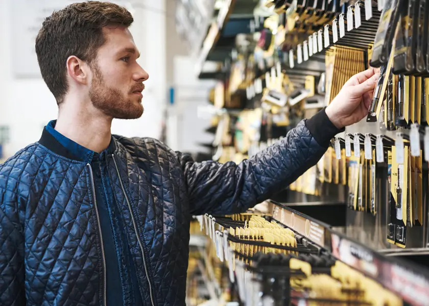 man shopping in retail hardware store